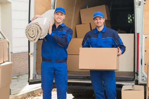 Local Charlton moving van team handling boxes and household items