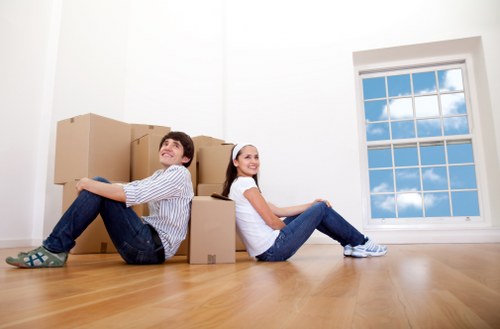 Removal team planning a Charlton home move with boxes and furniture