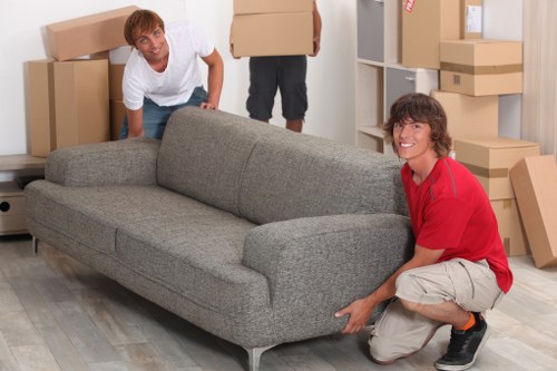 Professional movers handling furniture in Charlton