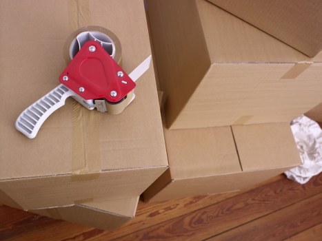 Removal team handling boxes and furniture for a local move