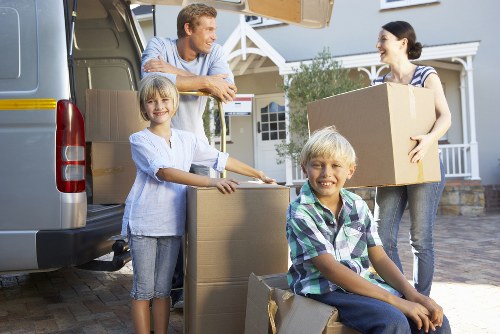 Loading furniture and boxes into a removals van in Charlton