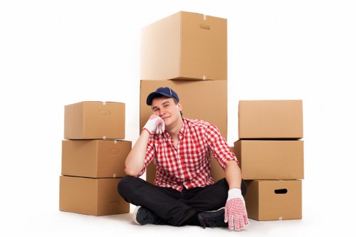 Staff using public liability insurance and safety procedures during a move
